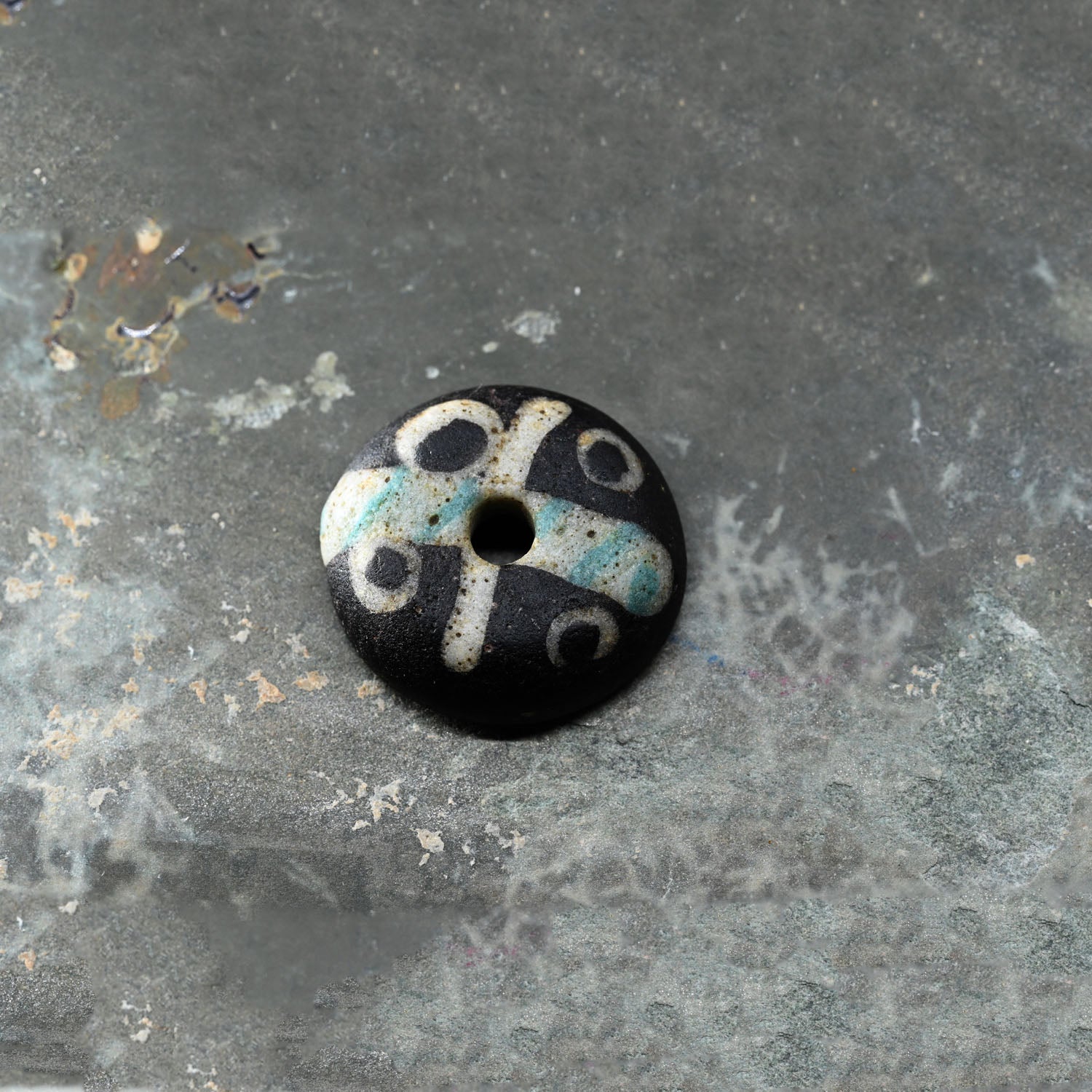 A Roman Decorated Glass Spindle Whorl, Roman Imperial Period, ca. 2nd - 3rd century CE