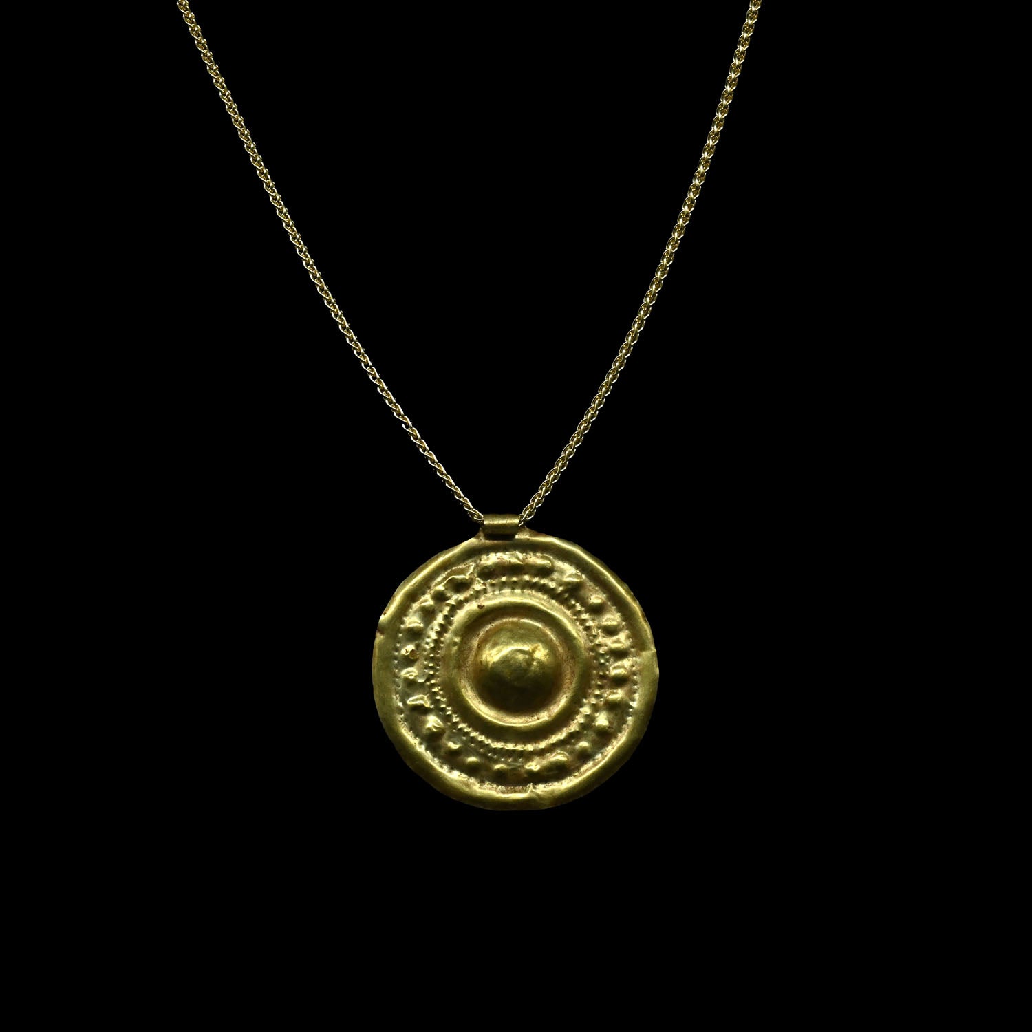 A large Western Asiatic Gold Disk Pendant, ca late 2nd Millennium BCE