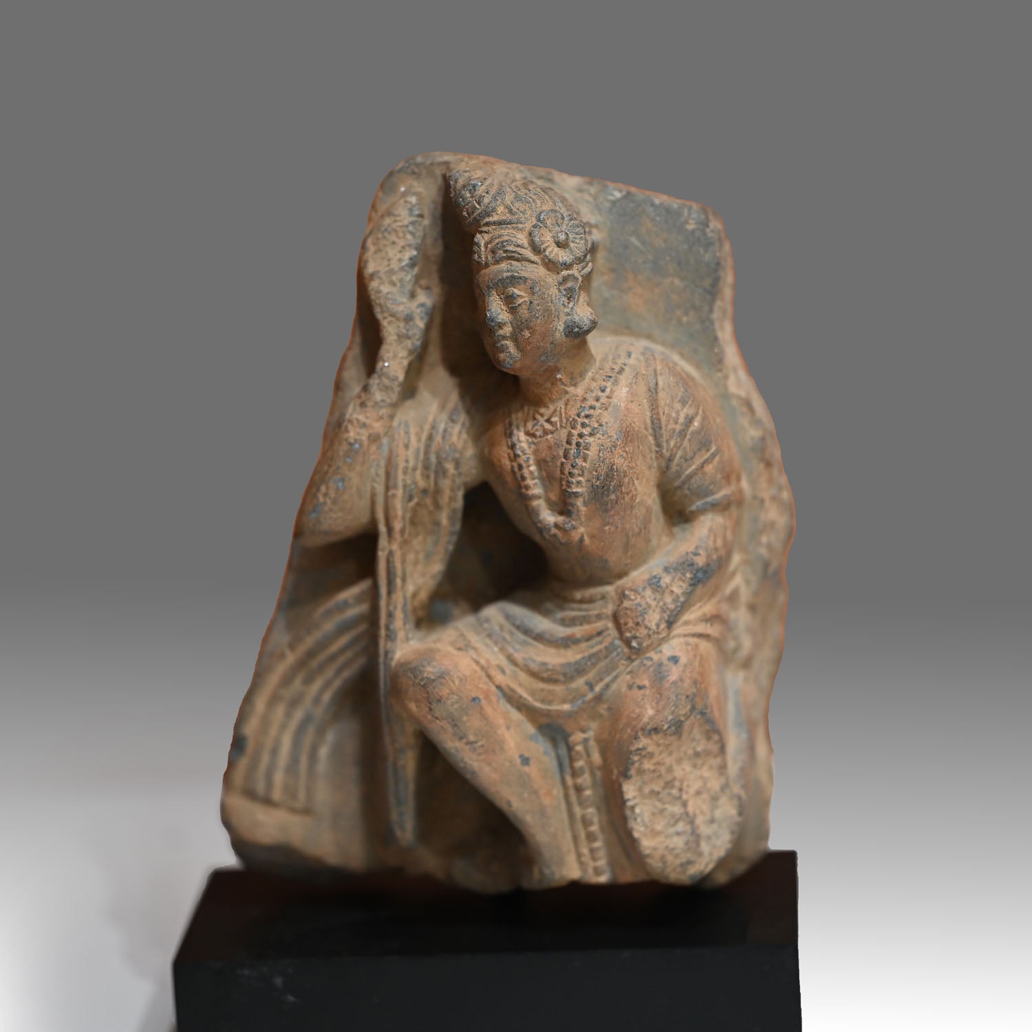 A Gandhara Relief Fragment of a Priestly Attendant, ca. 4th century CE