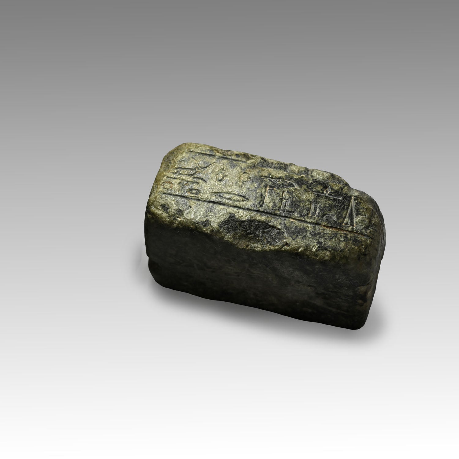 An Egyptian Granite Fragmentary Base with Inscription, Late Period, 29th-30th Dynasty, ca. 380 - 332 BCE