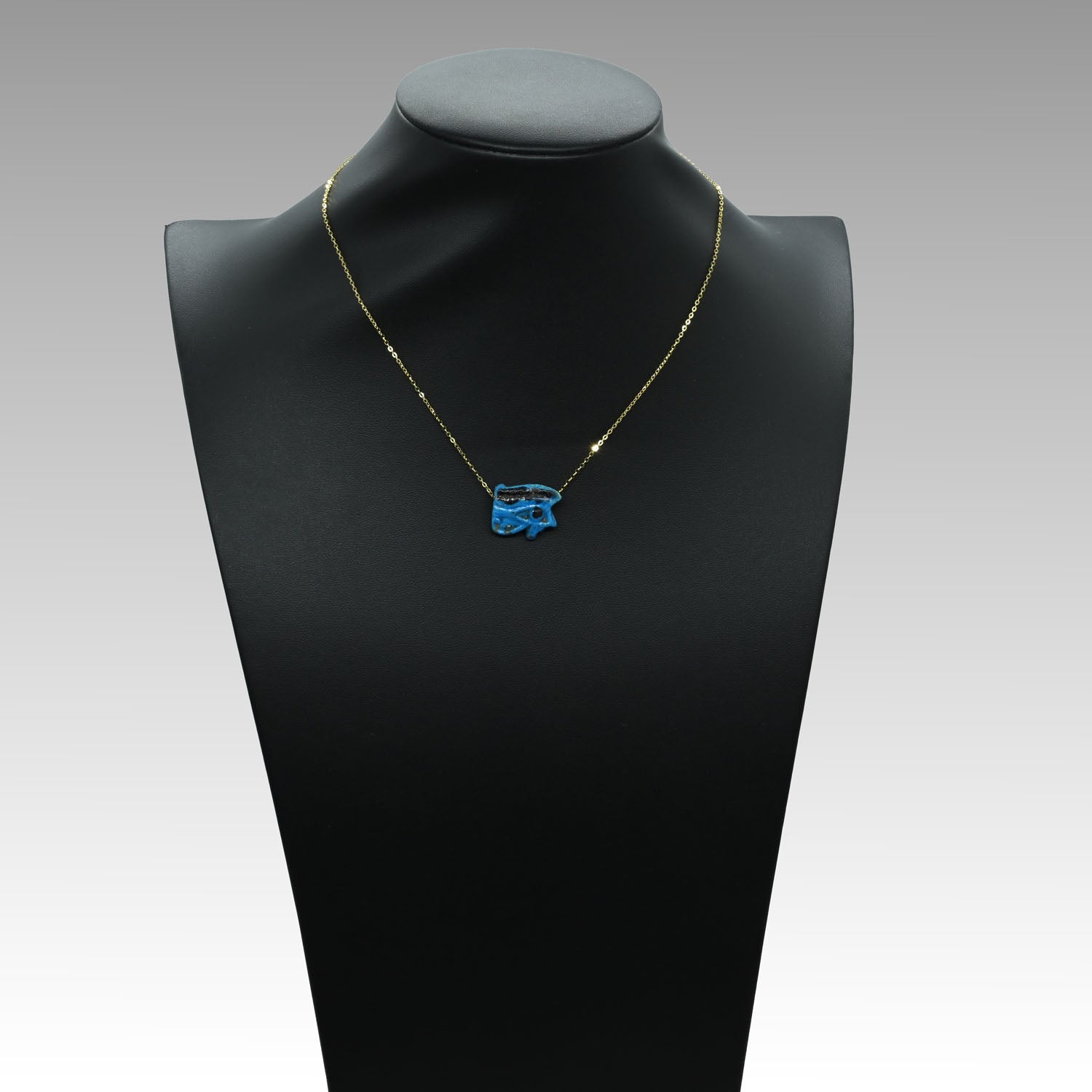 An Egyptian blue faience wedjet eye pendant, 21st Dynasty , ca. 1069 - 945 BCE