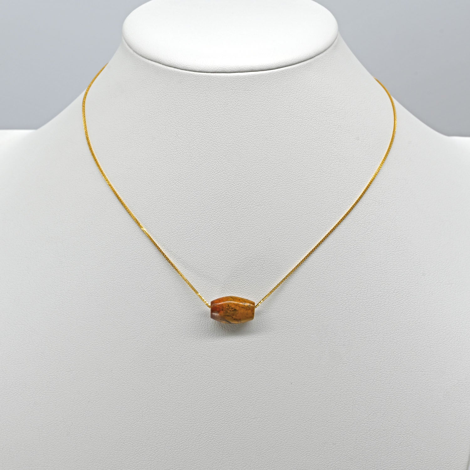 A rare Egyptian Yellow Jasper Bead Pendant, New Kingdom, 18th Dynasty, 1550-1295 BC