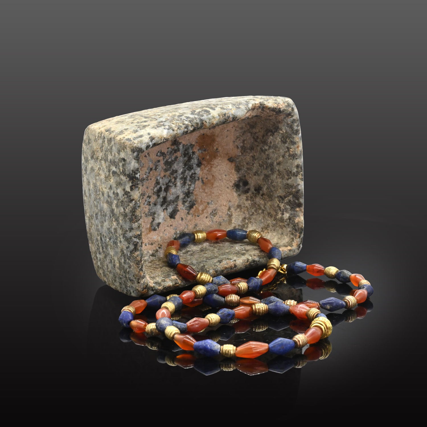 A Neo-Babylonian Lapis, Carnelian, and Gold Necklace, Neo Babylonian Period, ca. 626 - 539 BCE