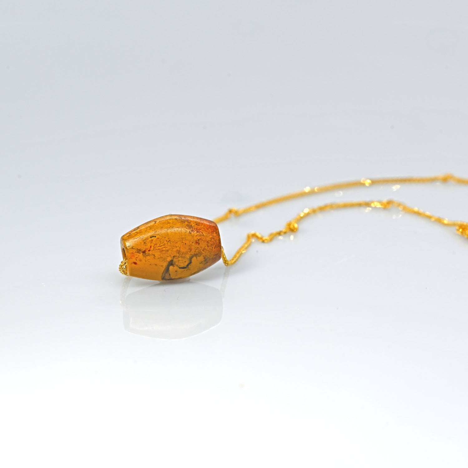 A rare Egyptian Yellow Jasper Bead Pendant, New Kingdom, 18th Dynasty, 1550-1295 BC