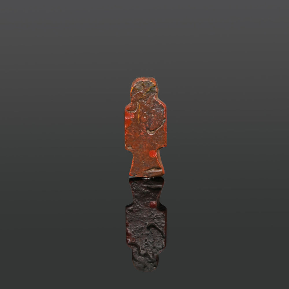 An Egyptian Red Glass Isis Knot Amulet, 18th Dynasty, Amarna Period, ca. 1350 - 1336 BCE