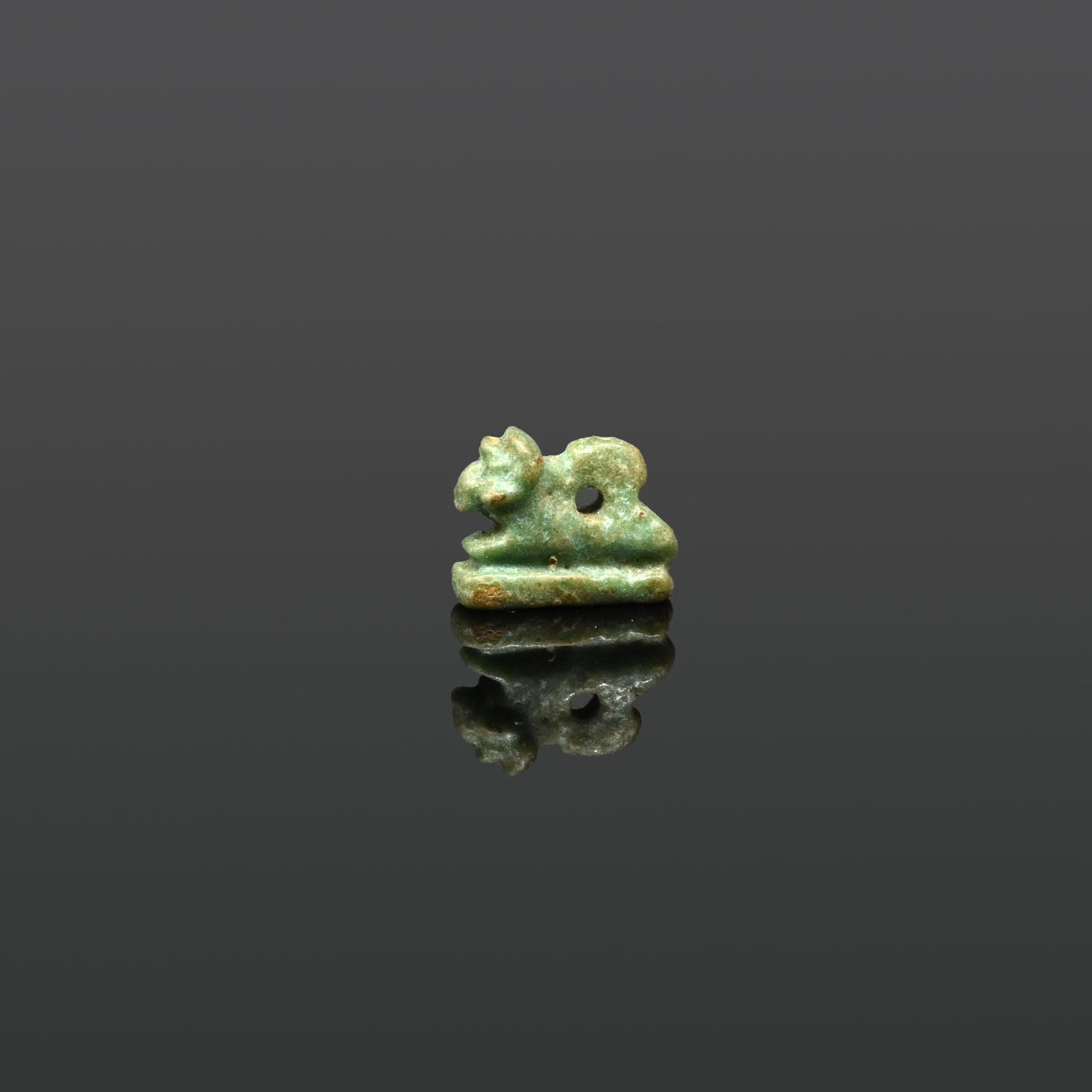 An Egyptian Faience Amulet of a Recumbent Ram, Late Period, ca. 664 - 332 BCE