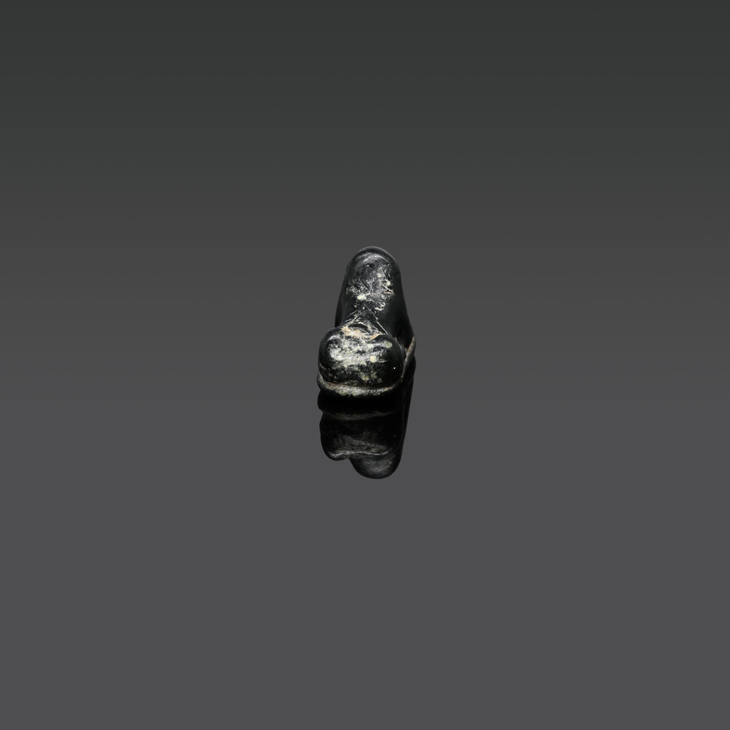 An Egyptian Serpentine Inscribed Scaraboid of a Recumbent Ram, 18th Dynasty, ca. 1550 - 1295 BCE