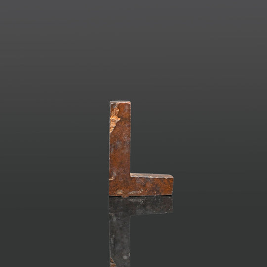 An Egyptian Hematite Set Square Amulet, Late Period, ca. 664 - 332 BCE