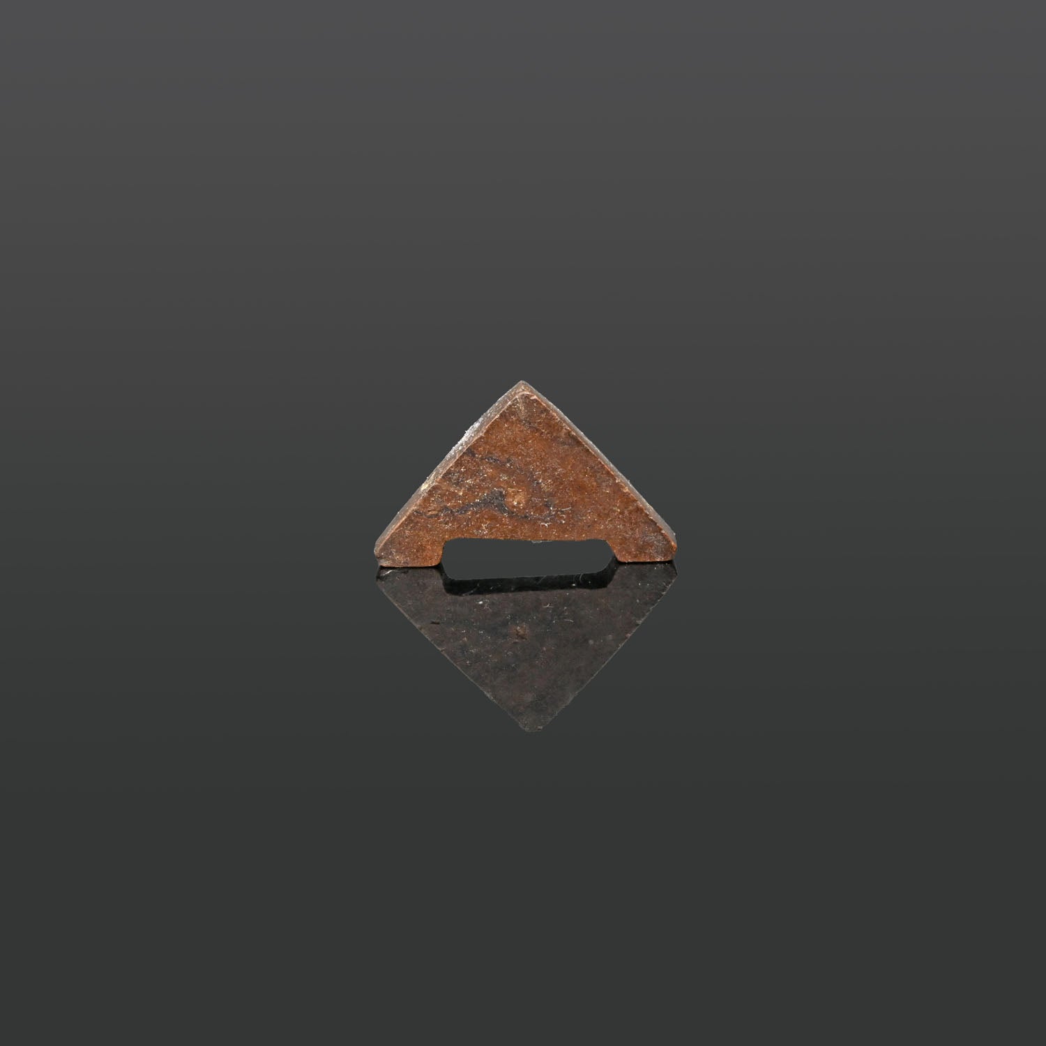 An Egyptian Hematite Plummet Amulet, Late Period, ca. 664 - 332 BCE