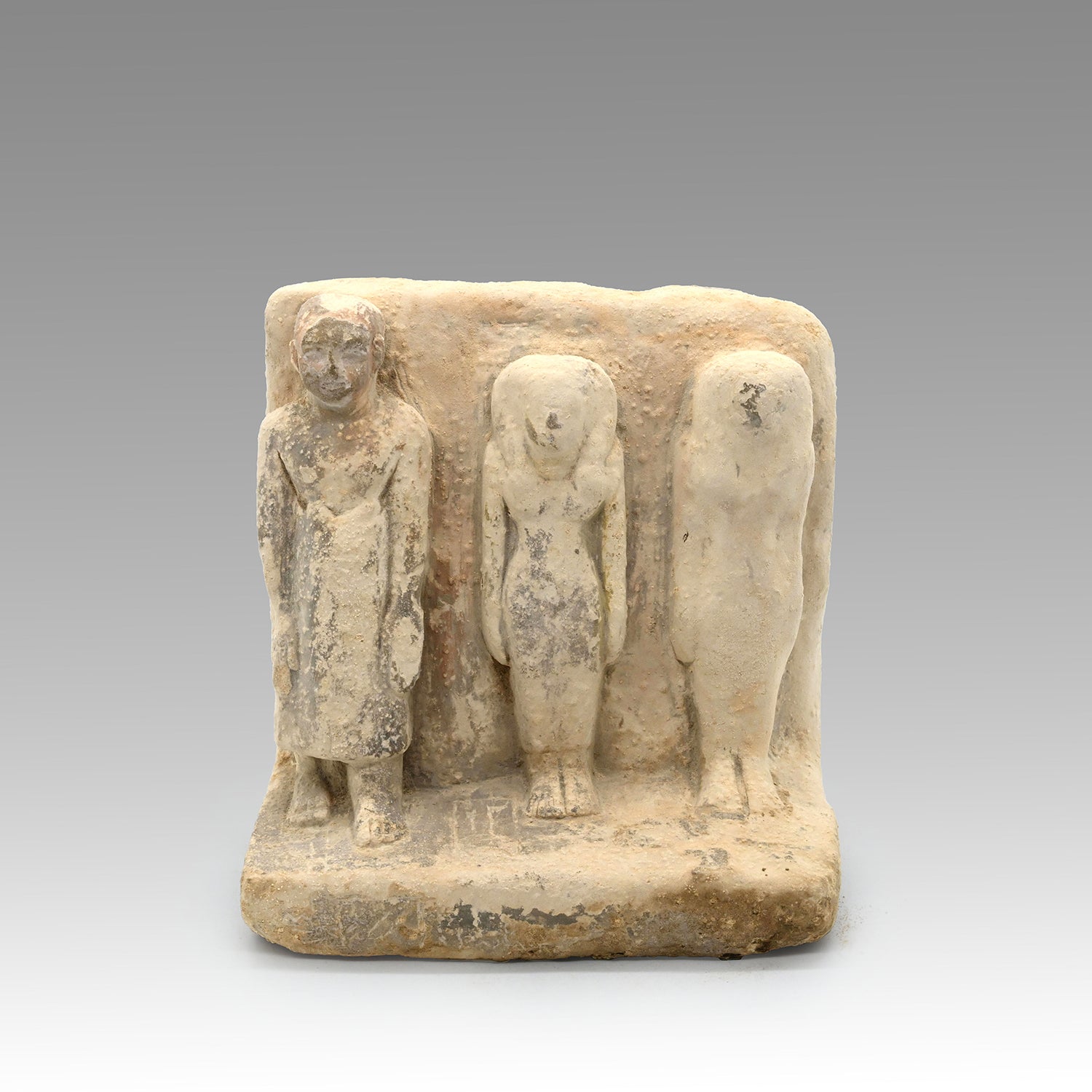 An Egyptian Limestone Family Plaque, Middle Kingdom, 12th Dynasty, ca. 1991 – 1786 BCE