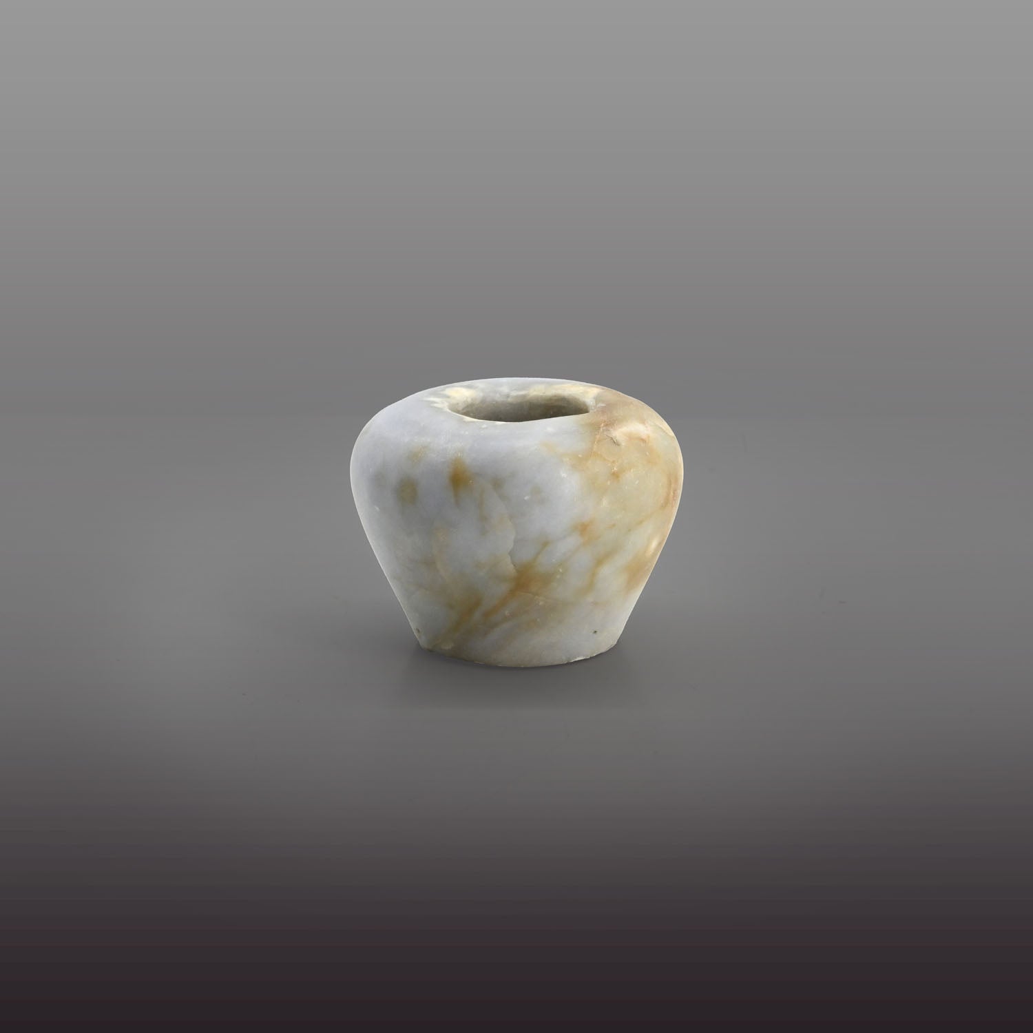 An elegant Egyptian Anhydrite Kohl Vessel, Middle Kingdom, XII Dynasty, not after 1786 BCE