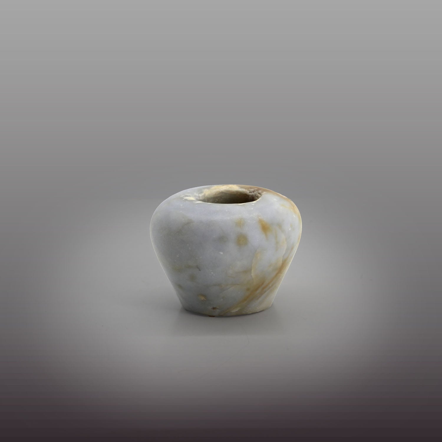 An elegant Egyptian Anhydrite Kohl Vessel, Middle Kingdom, XII Dynasty, not after 1786 BCE