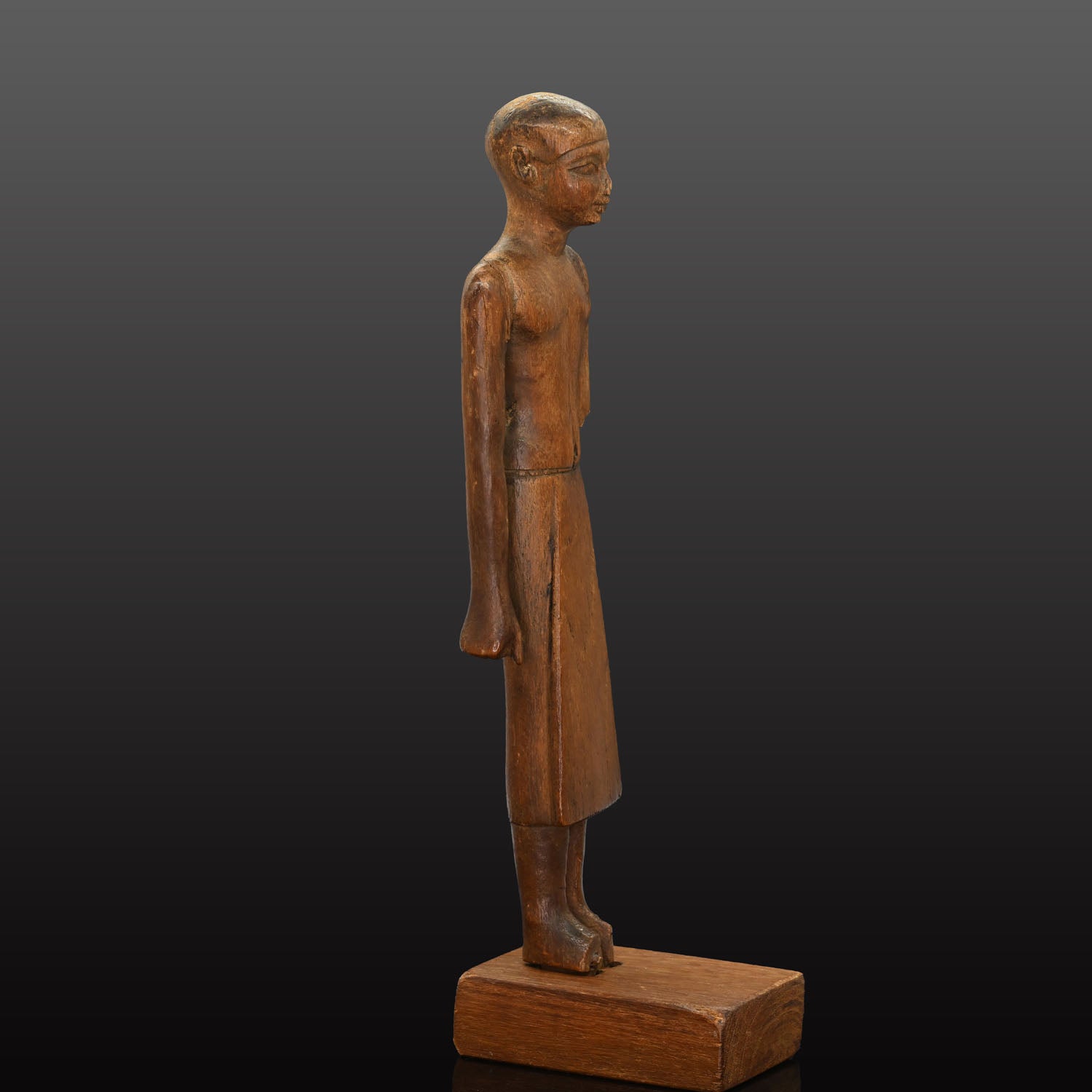 A Fine Egyptian Wooden Standing Dignitary Figure, Middle Kingdom, 11th - 12th Dynasty, ca. 2030 - 1802 BCE