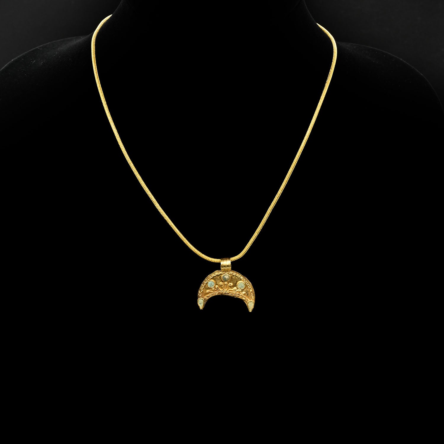 A superb Hellenistic Gold and Glass Crescent Pendant, ca. 2nd century BCE