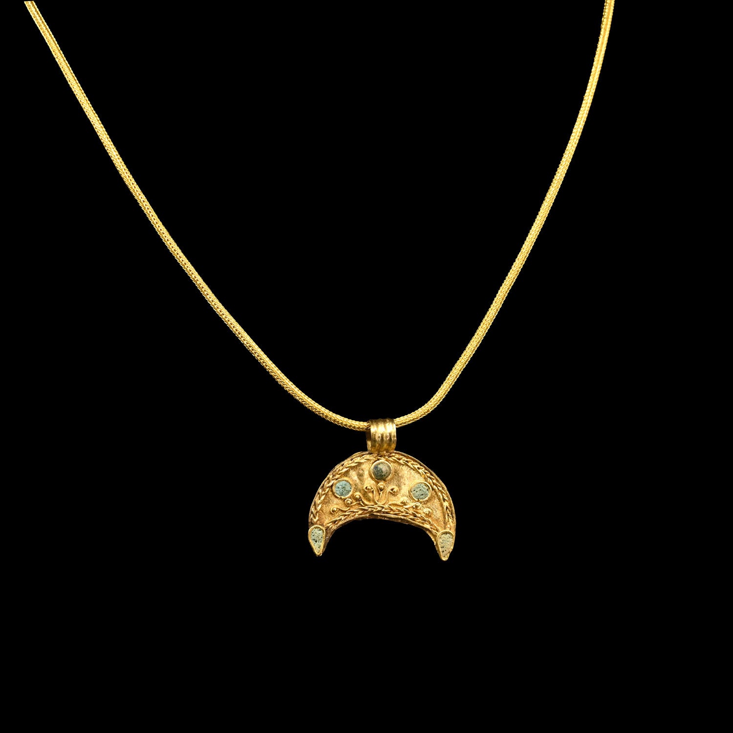A superb Hellenistic Gold and Glass Crescent Pendant, ca. 2nd century BCE