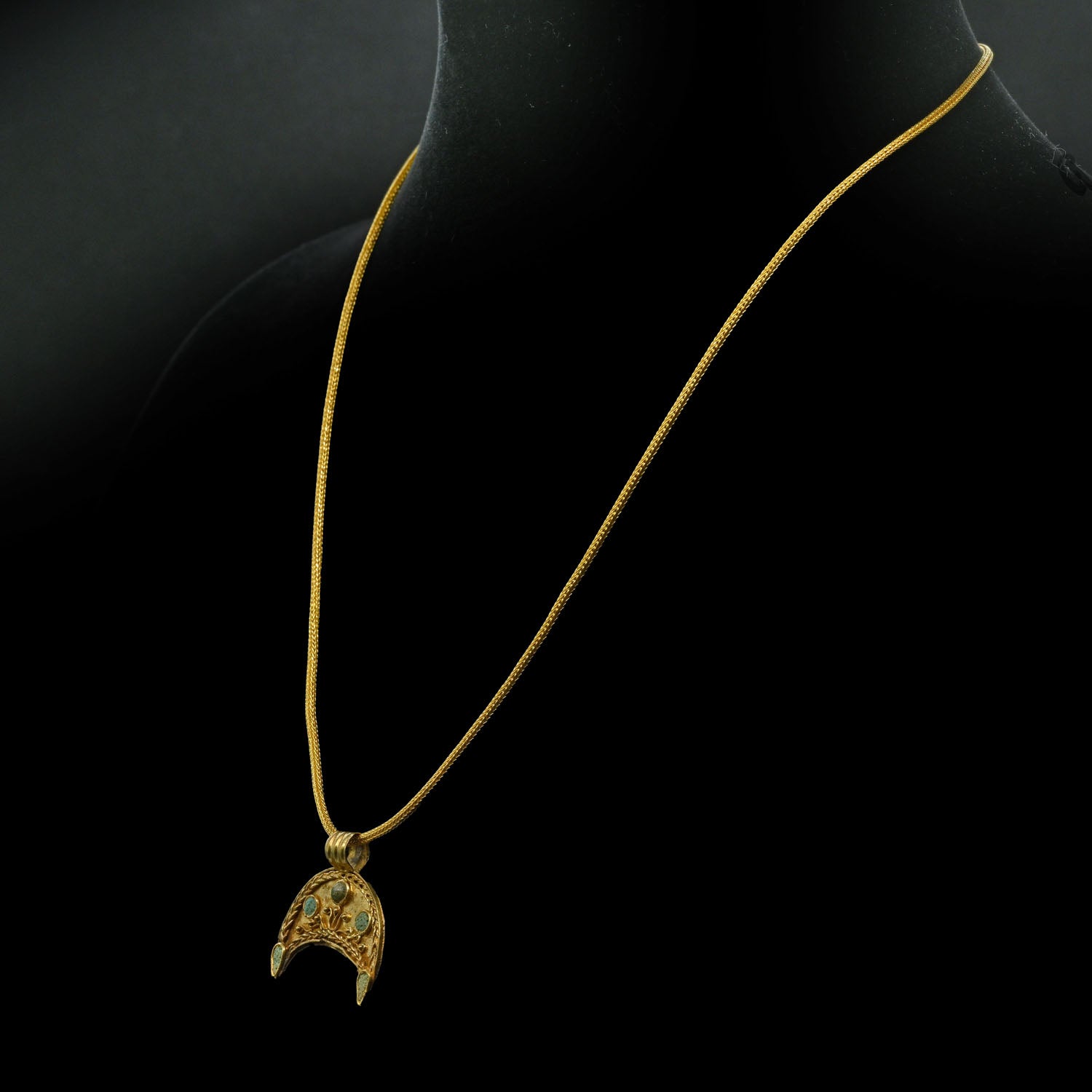 A superb Hellenistic Gold and Glass Crescent Pendant, ca. 2nd century BCE