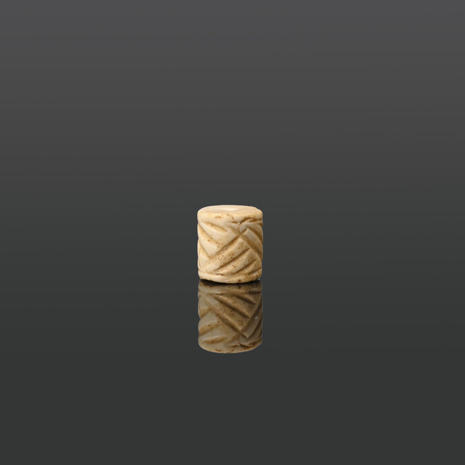 A Mesopotamian Marble Cylinder Seal, Jemdet Nasr Period, ca. 3100 - 2700 BCE