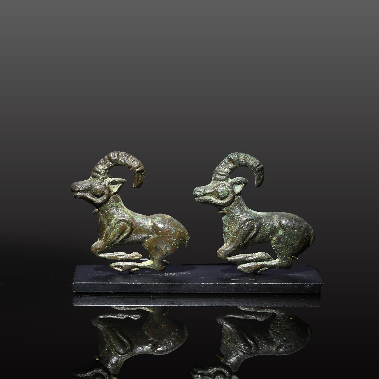 A fine published Pair of Eurasian Bronze Ibex Appliques, ca. 4th century BCE