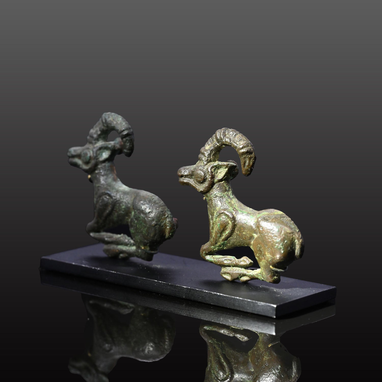 A fine published Pair of Eurasian Bronze Ibex Appliques, ca. 4th century BCE