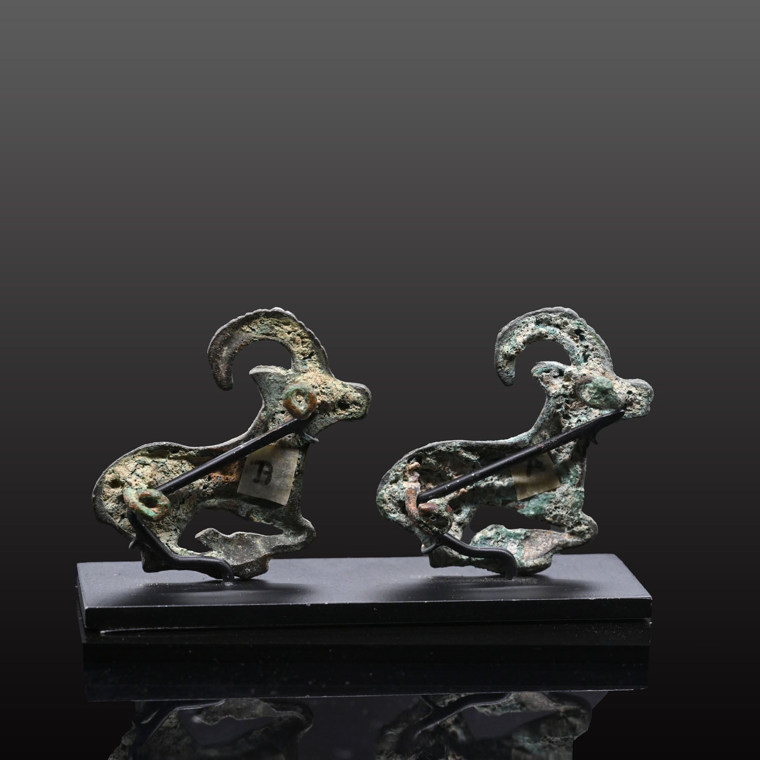 A fine published Pair of Eurasian Bronze Ibex Appliques, ca. 4th century BCE