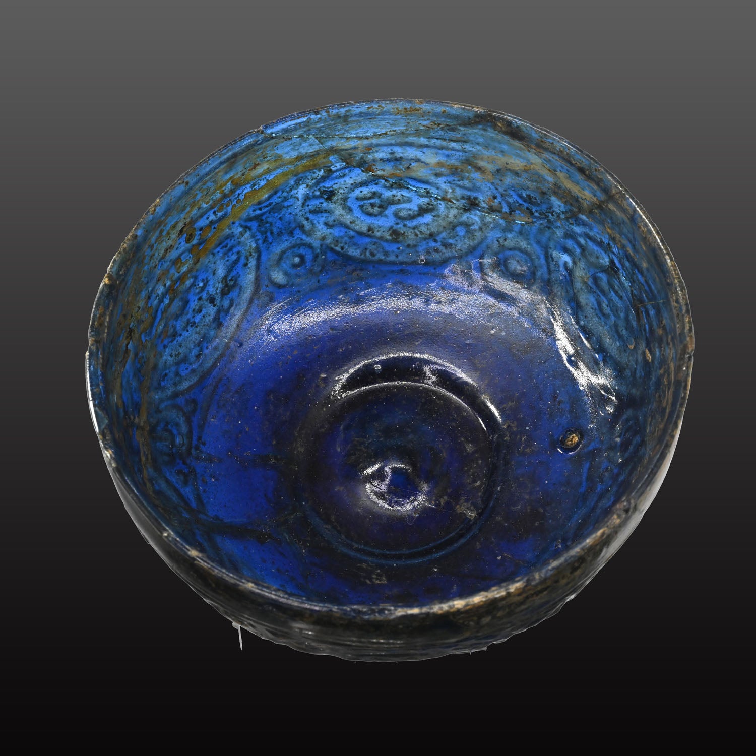 A Rare Islamic Molded Cobalt Blue Glass Bowl, Early Islamic Period, ca. 7th - 10th century CE