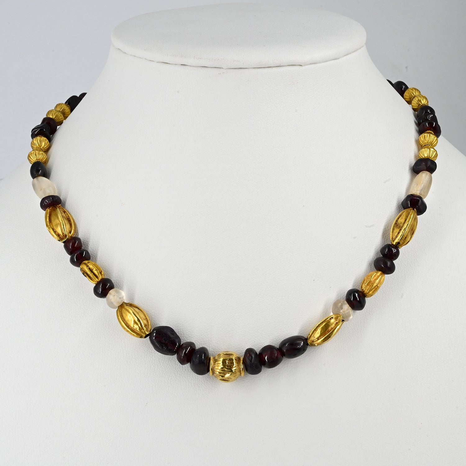 A superb Persian Gold, Garnet, and Crystal Necklace, Achaemenid Period, ca 550 - 300 BCE