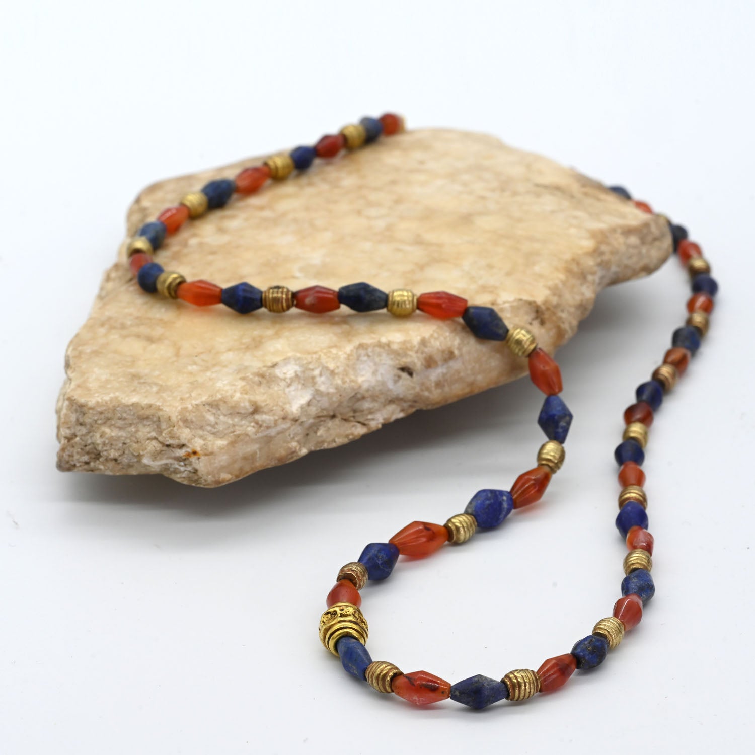 A Neo-Babylonian Lapis, Carnelian, and Gold Necklace, Neo Babylonian Period, ca. 626 - 539 BCE