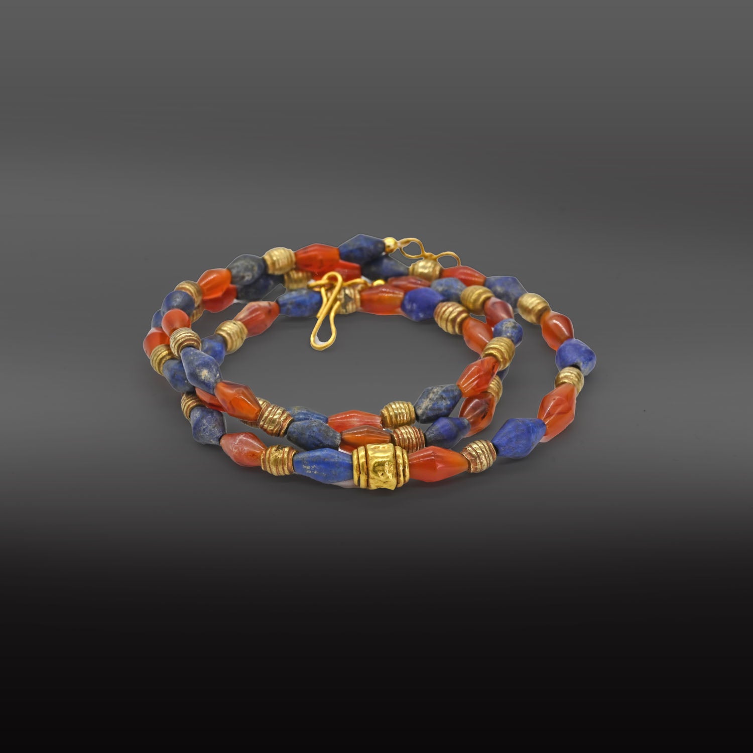 A Neo-Babylonian Lapis, Carnelian, and Gold Necklace, Neo Babylonian Period, ca. 626 - 539 BCE