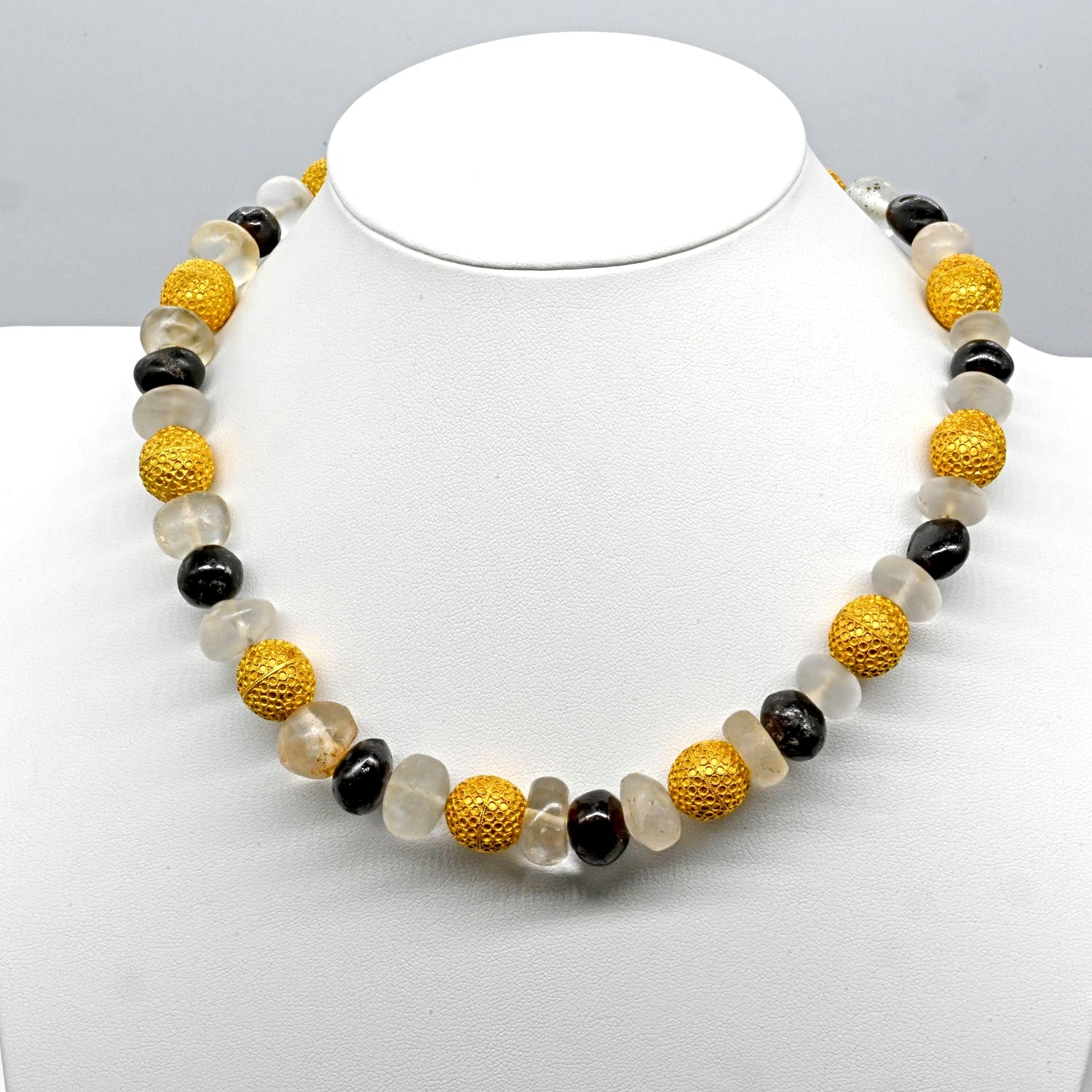 An Elegant Byzantine Gold, Quartz and Garnet Bead Necklace, ca. 9th century CE