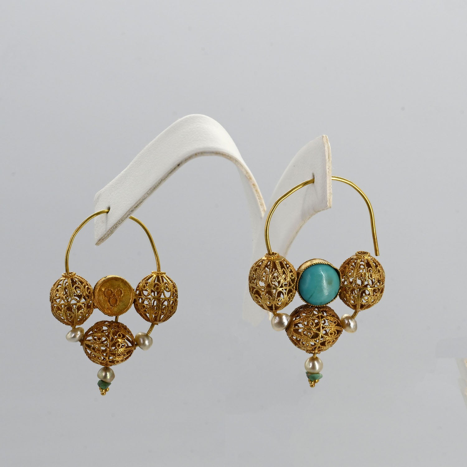 An exceptional pair of Islamic Gold, Turquoise, and Pearl Earrings, ca. 10th century CE