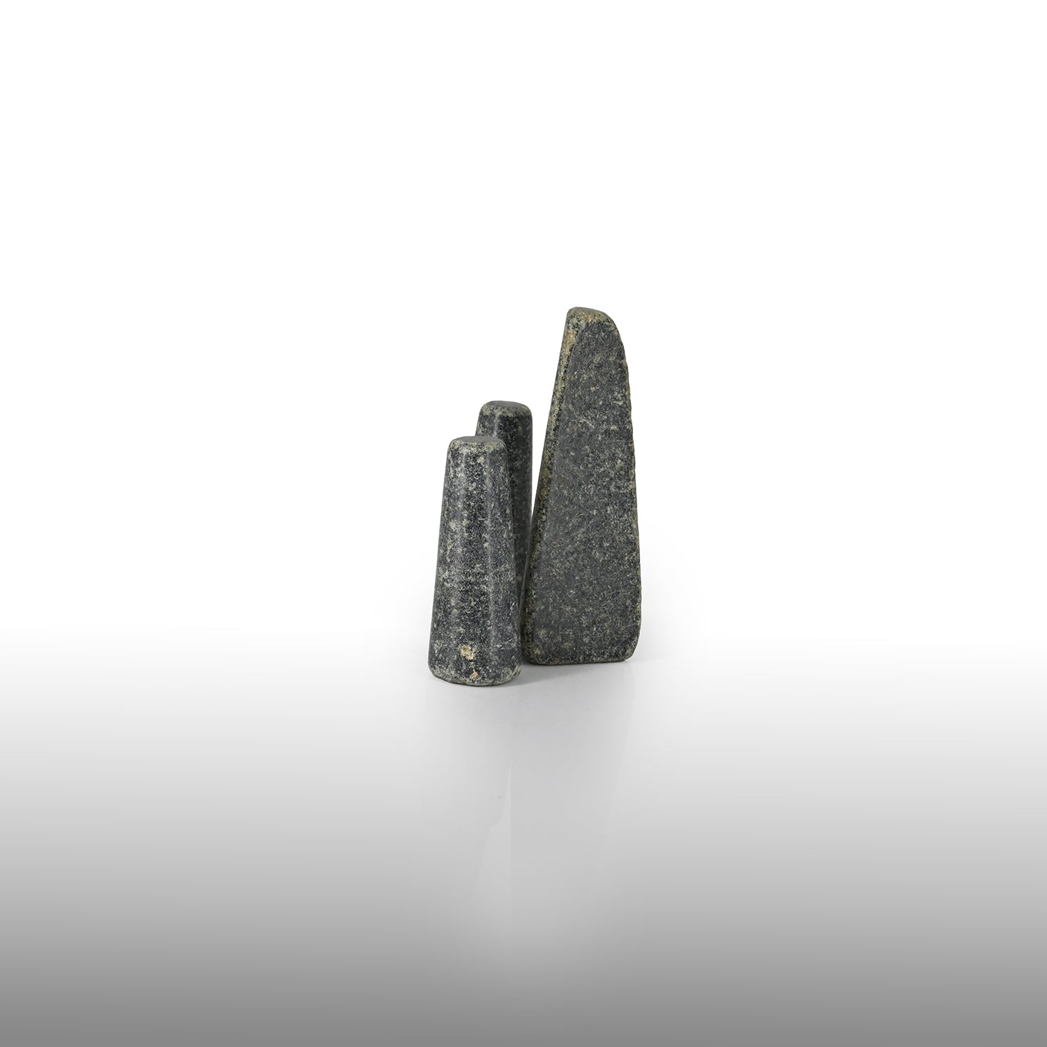 A set of three rare Sumerian Granite Gaming Pieces, Early Bronze Age, ca. 3100 - 2200 BCE
