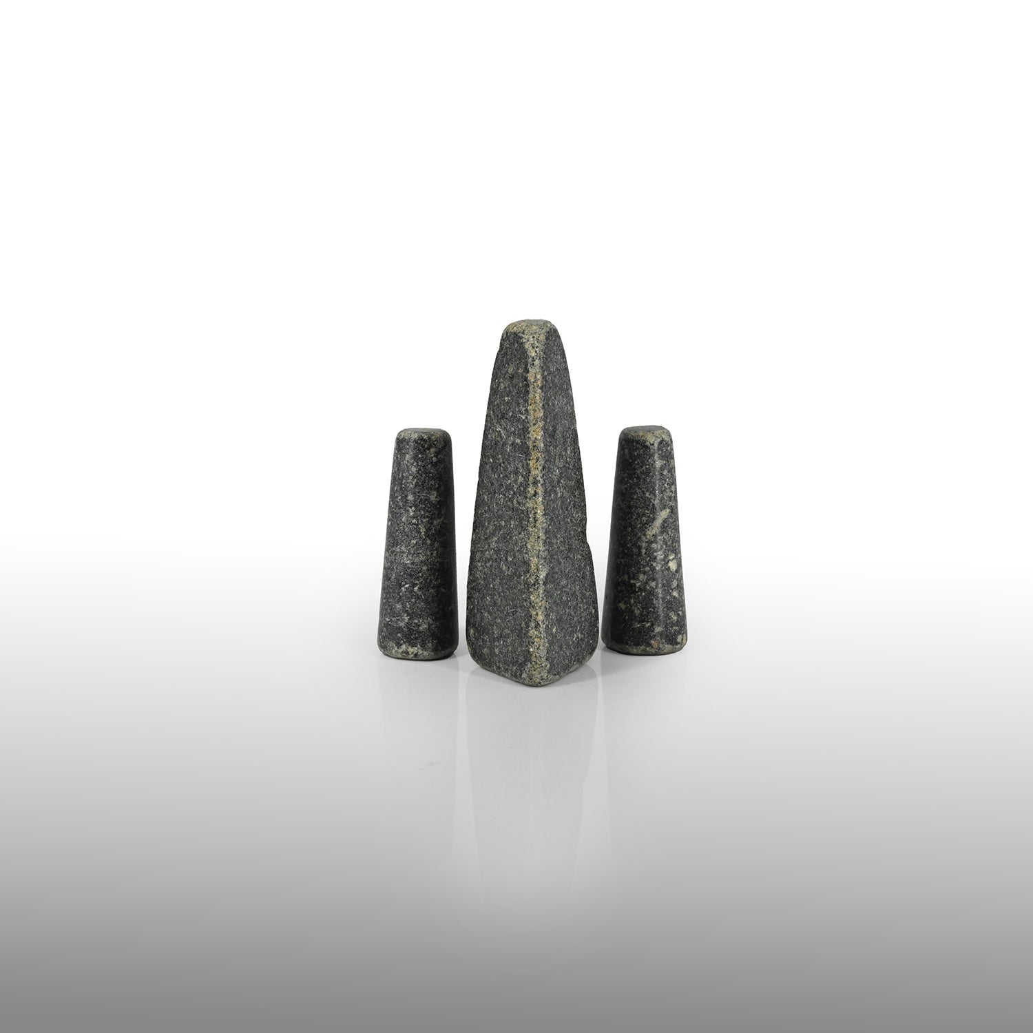 A set of three rare Sumerian Granite Gaming Pieces, Early Bronze Age, ca. 3100 - 2200 BCE