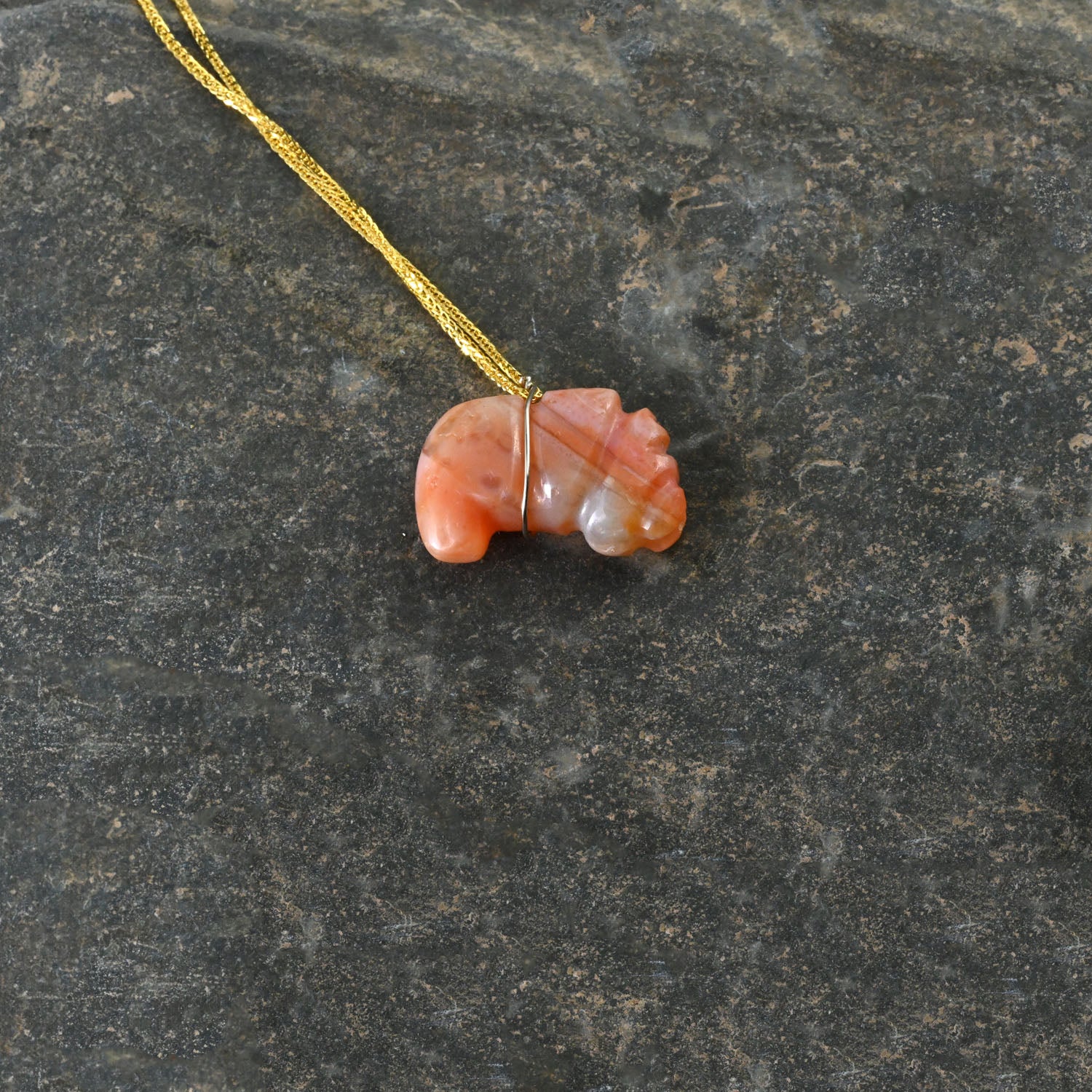 A Tairona Carnelian Gusanos Pendant, Northern Colombia, ca. 800 - 1500 CE