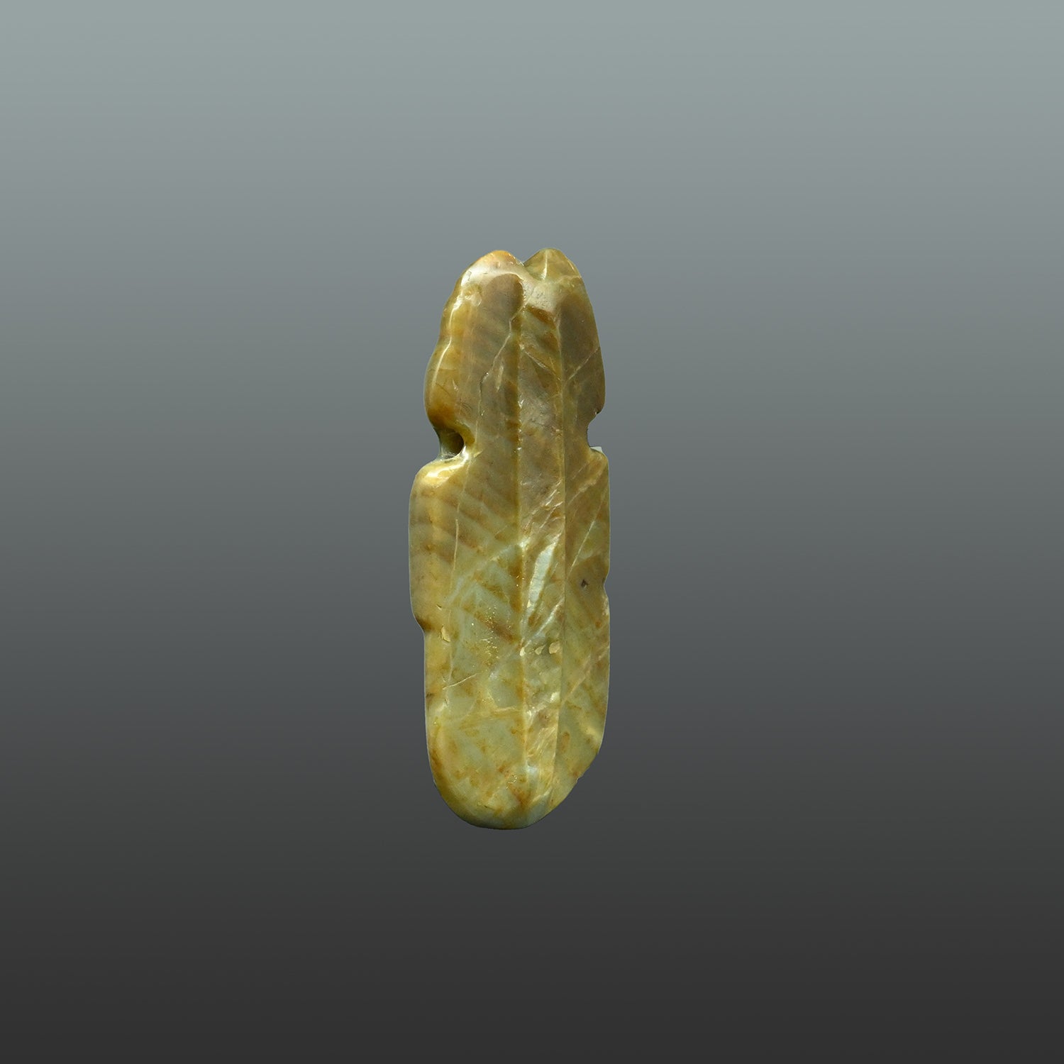 A Costa Rican Greenstone Axe God Pendant, Early Classic Period, ca. 100 - 600 CE