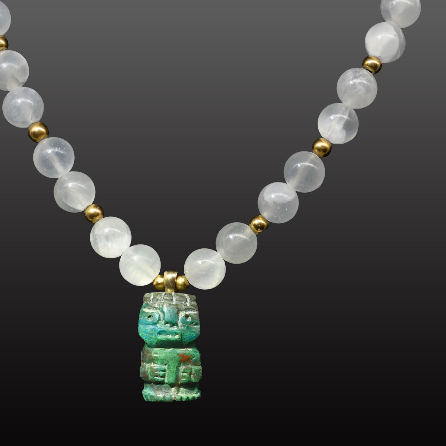 A Chimu-Inca Chrysocolla Pendant, ca. 800 - 1425 CE