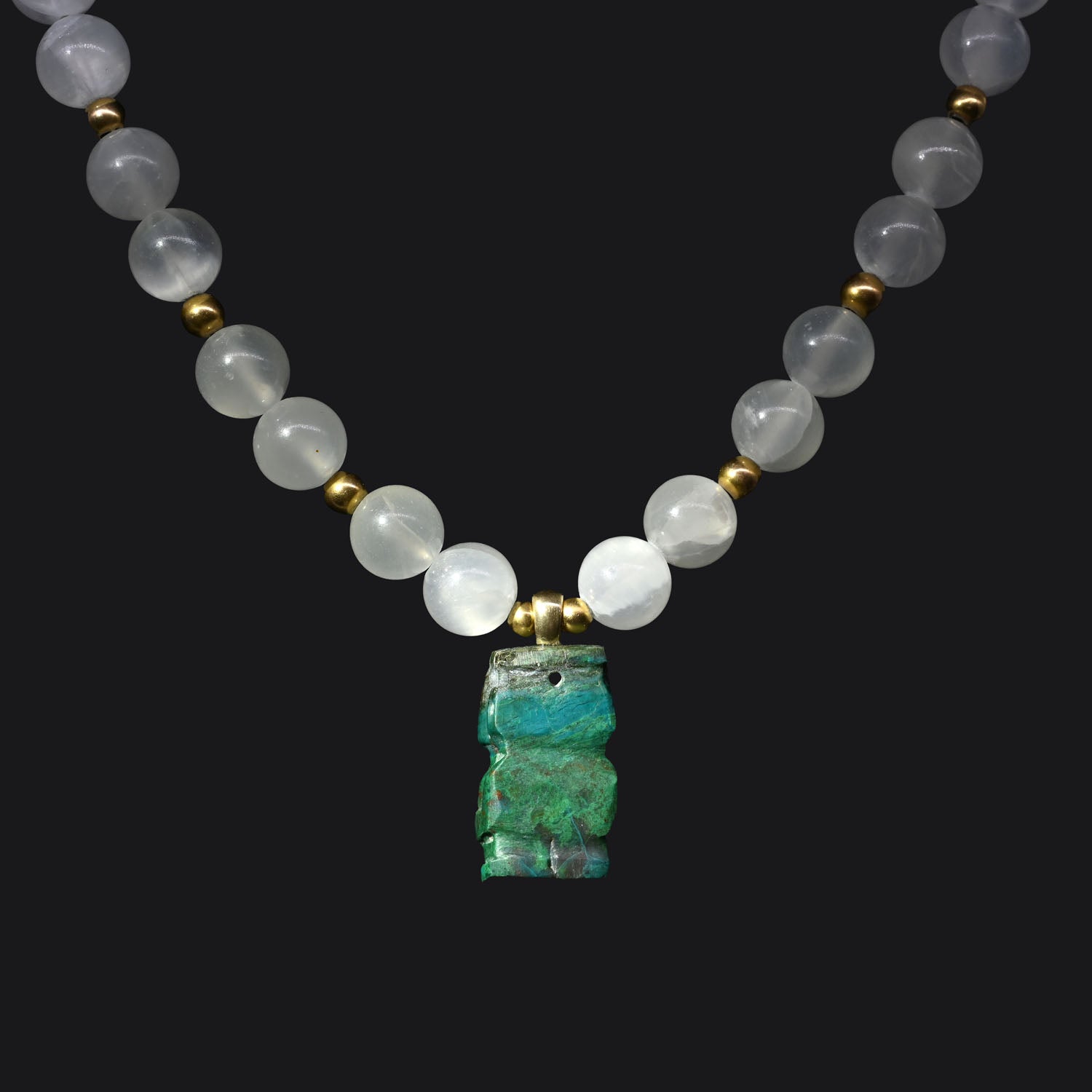 A Chimu-Inca Chrysocolla Pendant, ca. 800 - 1425 CE