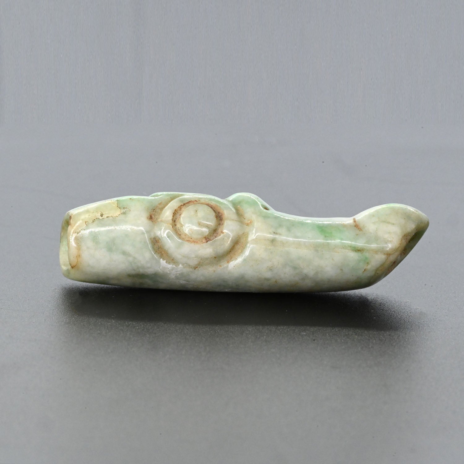A published Maya Jade Alligator Head Bead, Late Classic Period, ca. 550 - 950 CE