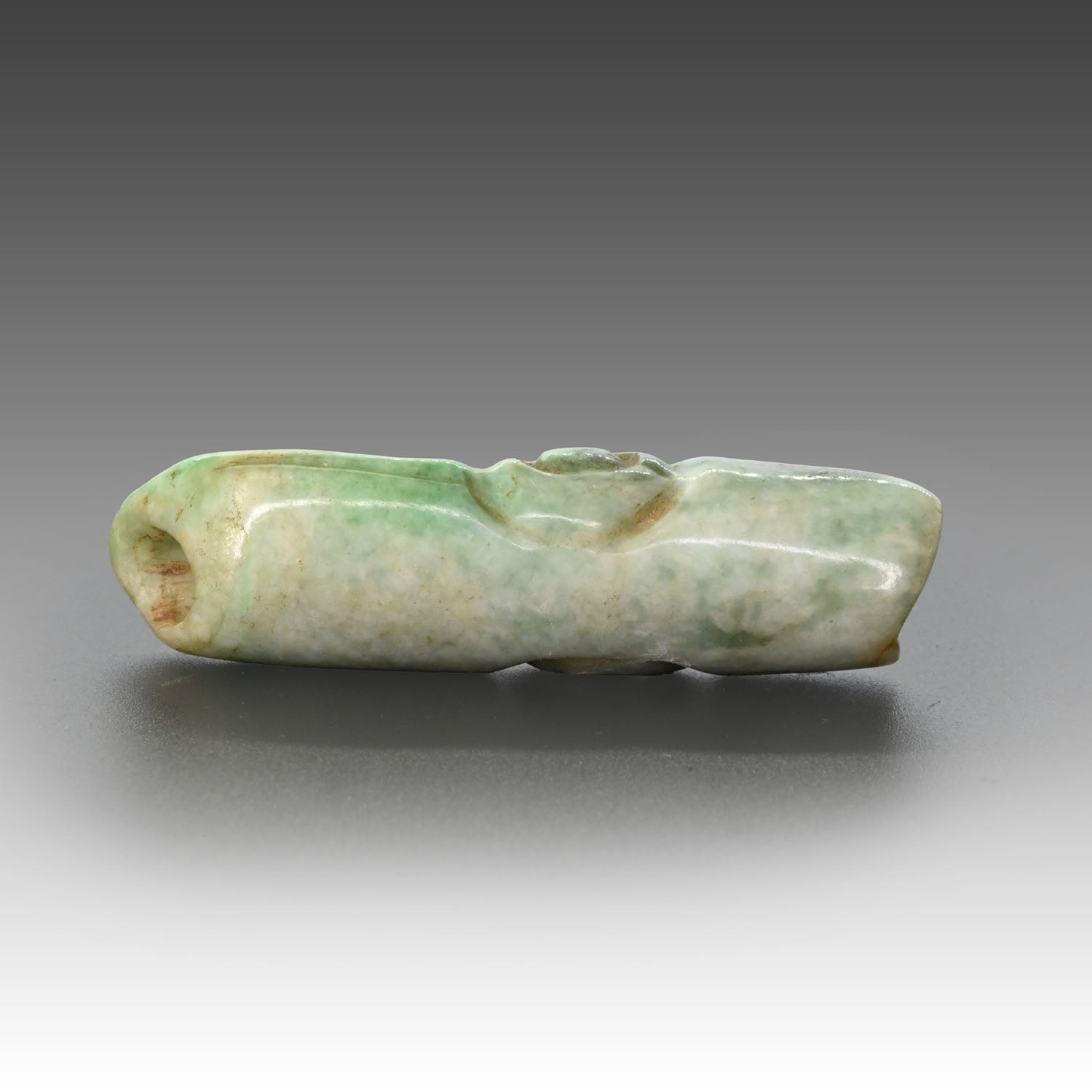 A published Maya Jade Alligator Head Bead, Late Classic Period, ca. 550 - 950 CE