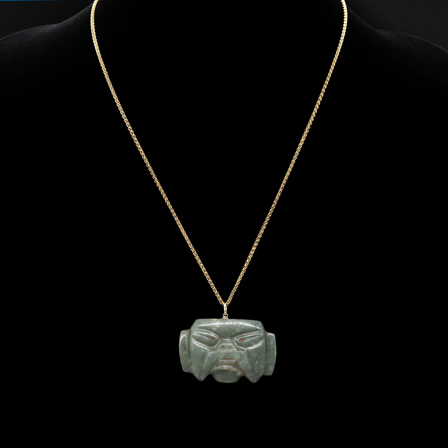 An Olmec Jade Were-jaguar Mask Amulet, Middle Preclassic Period, ca 900 - 600 BCE