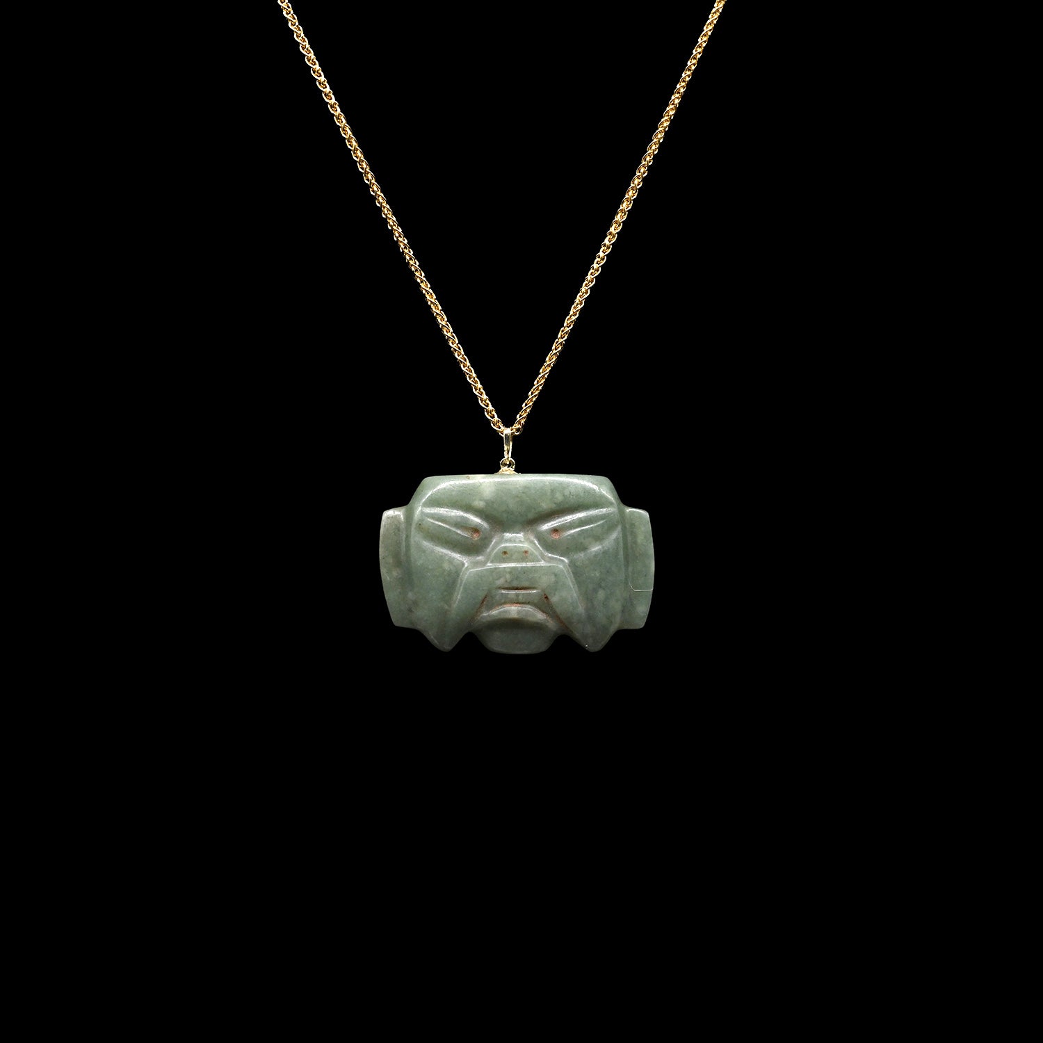 An Olmec Jade Were-jaguar Mask Amulet, Middle Preclassic Period, ca 900 - 600 BCE