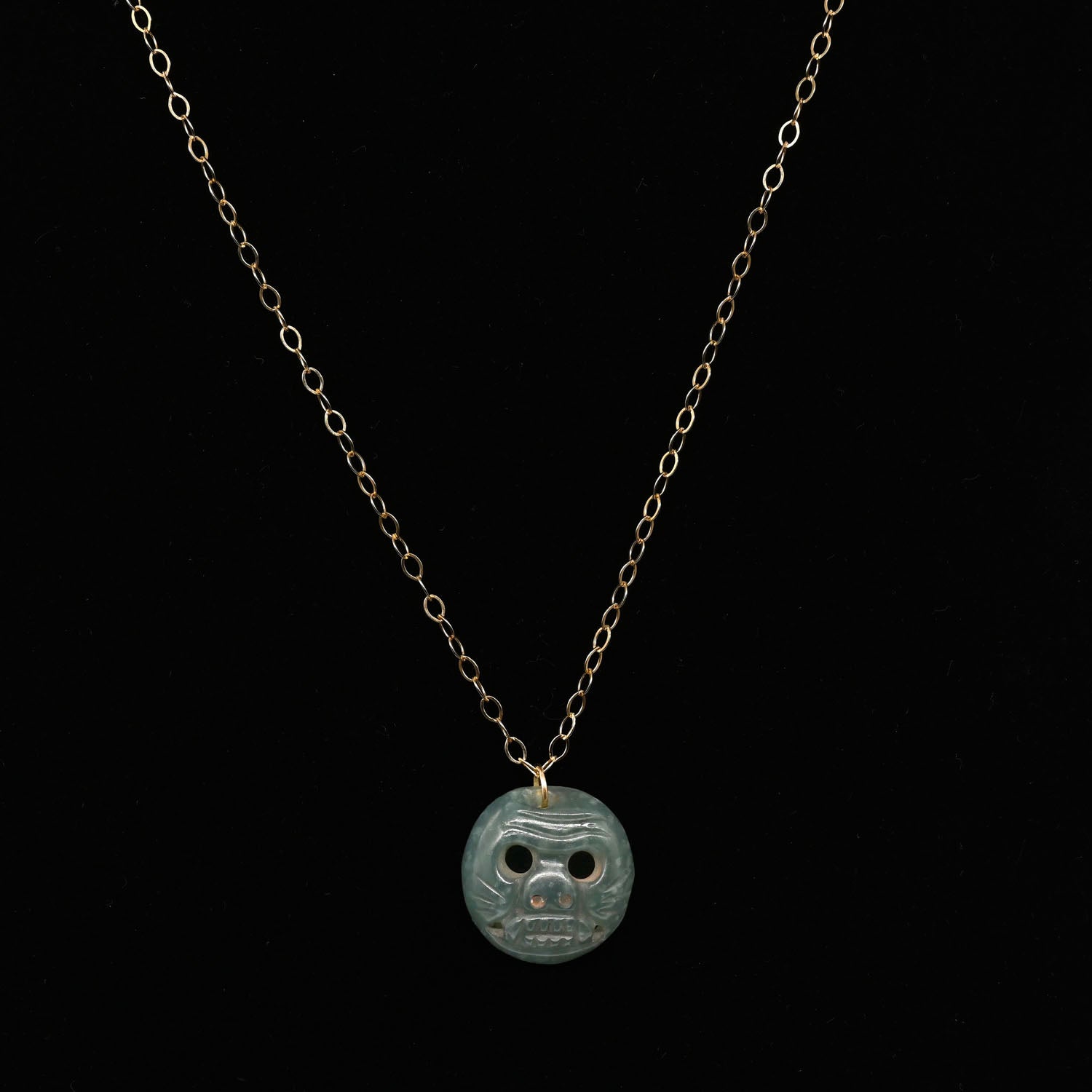 A Maya Jade Jaguar Pendant Necklace, Classic Period, ca. 600–900 CE