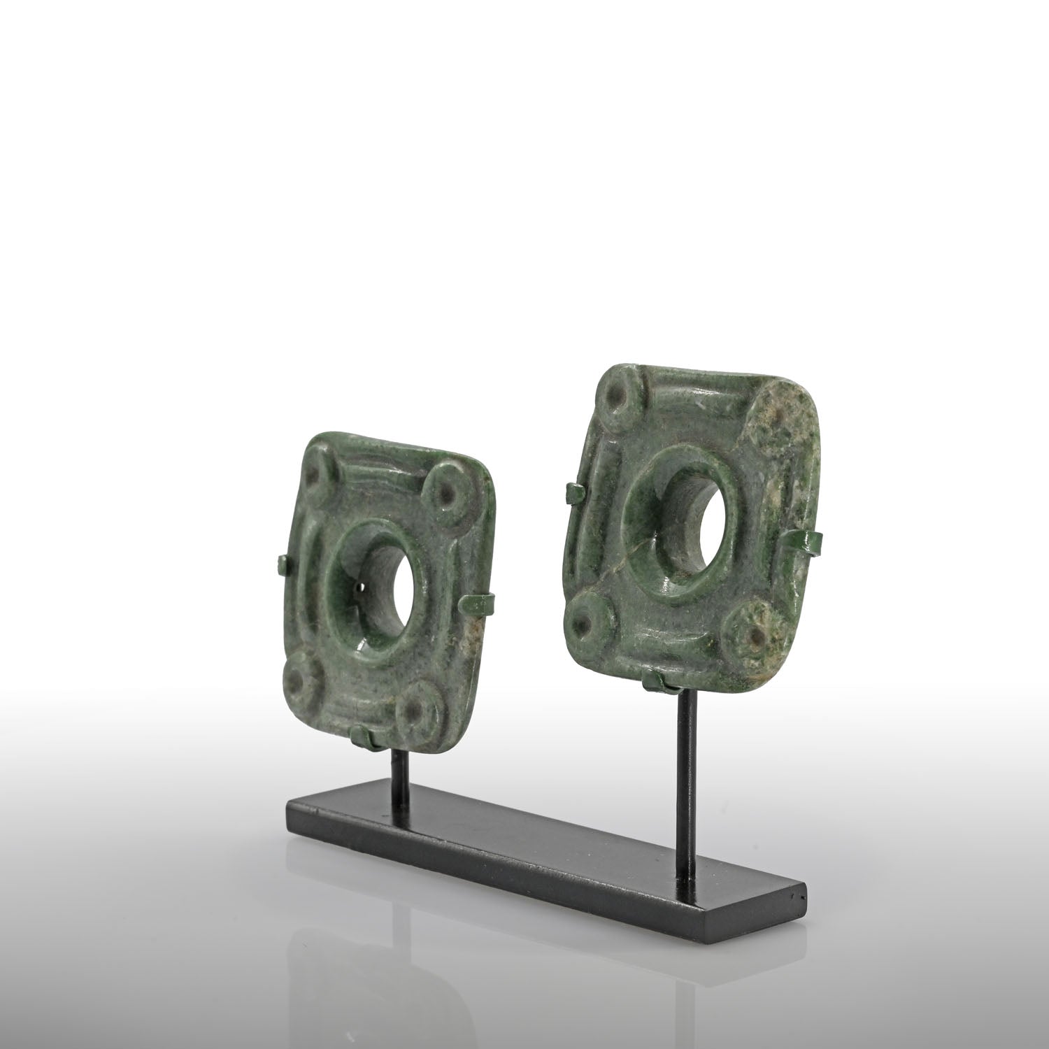 An exceptional pair of Maya Jade Pair of Earflare Frontals, Late Preclassic - Classic Period, ca. 200 - 600 CE