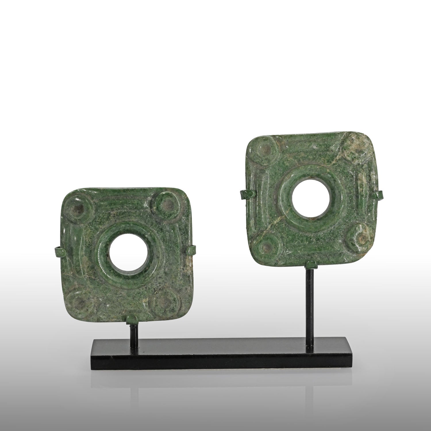 An exceptional pair of Maya Jade Pair of Earflare Frontals, Late Preclassic - Classic Period, ca. 200 - 600 CE