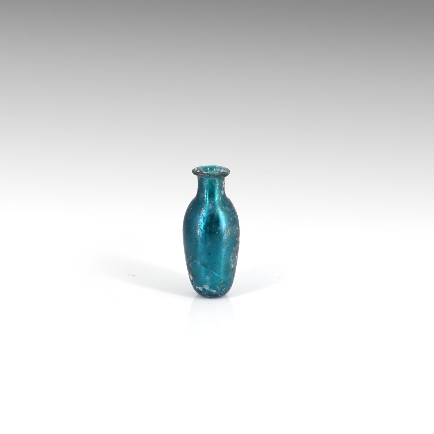 A small Roman Deep Blue Glass Bottle, early 3rd century CE