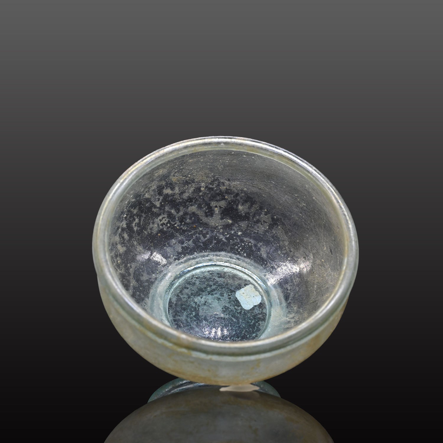 A small Roman Blue-Green Glass Bowl with Foot, Roman Imperial Period, ca. 3rd century CE
