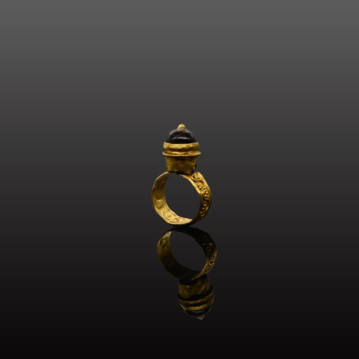 A Byzantine Garnet and Gold Domed Finger Ring, Byzantine Empire, ca. 5th - 7th century CE