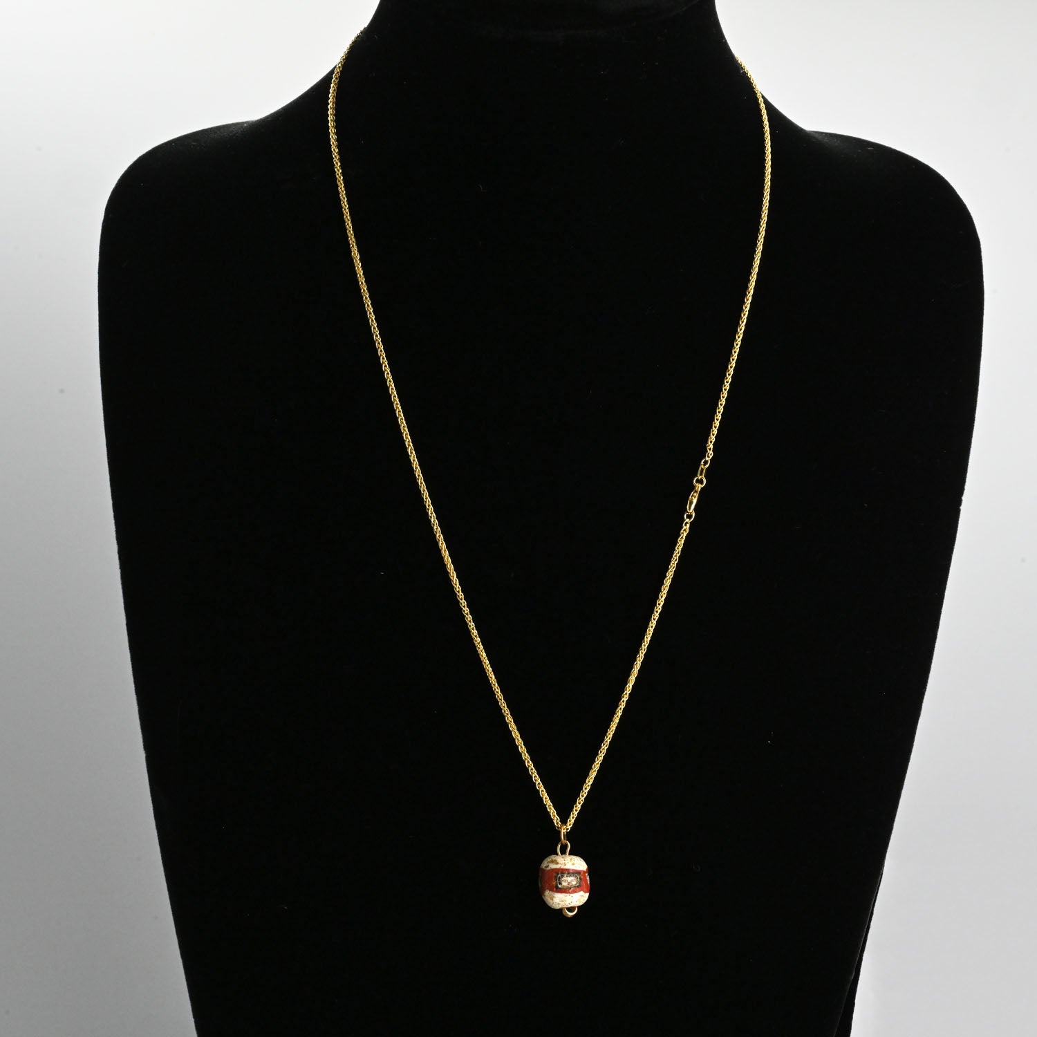 A fine Roman Glass Portrait Head Bead, Roman Imperial Period, ca. 100 - 200 CE