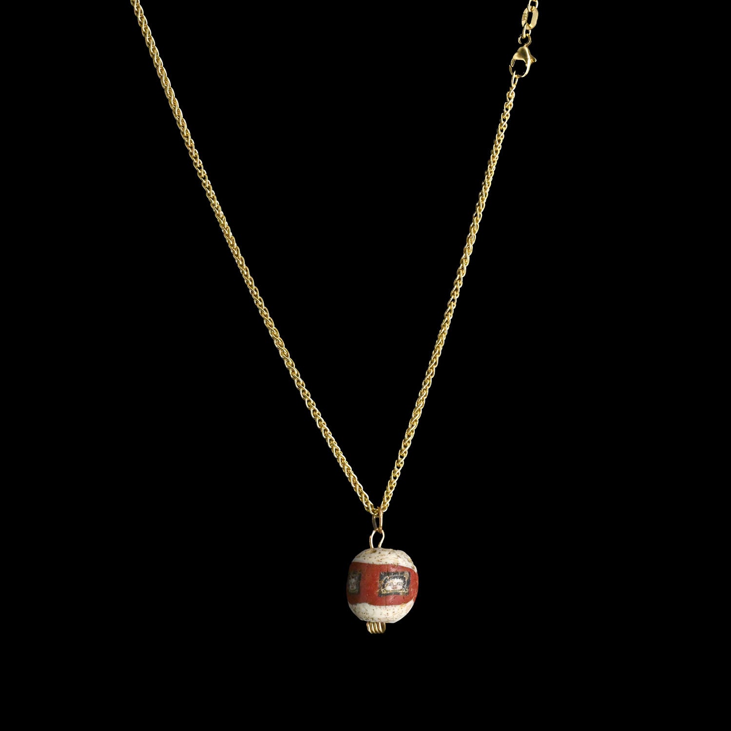 A fine Roman Glass Portrait Head Bead, Roman Imperial Period, ca. 100 - 200 CE