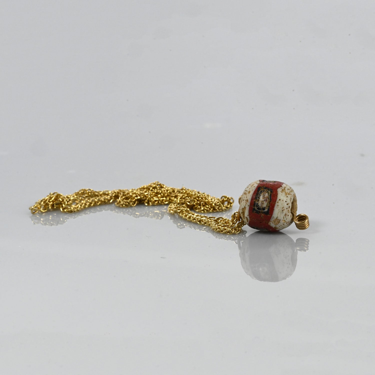 A fine Roman Glass Portrait Head Bead, Roman Imperial Period, ca. 100 - 200 CE