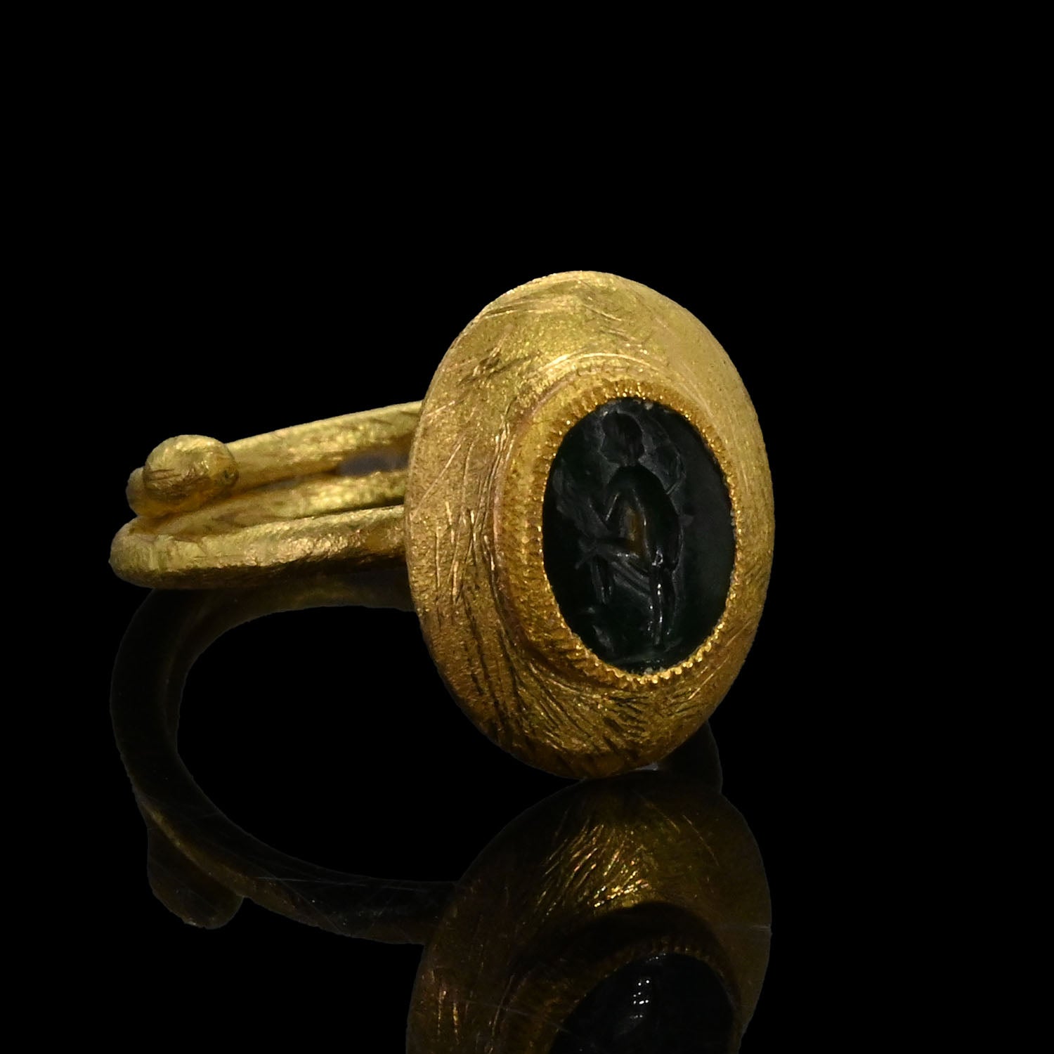 Roman Green Chalcedony Intaglio of Dancing Satyr set as a ring, Roman Imperial Period, ca. 1st - 3rd century CE